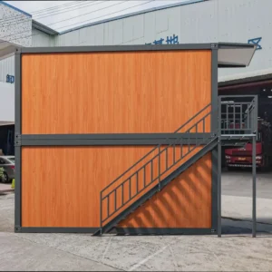 Interior of modular dormitory with bunk beds and wood finish.
