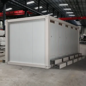 Interior of a modular toilet with ceramic fixtures.